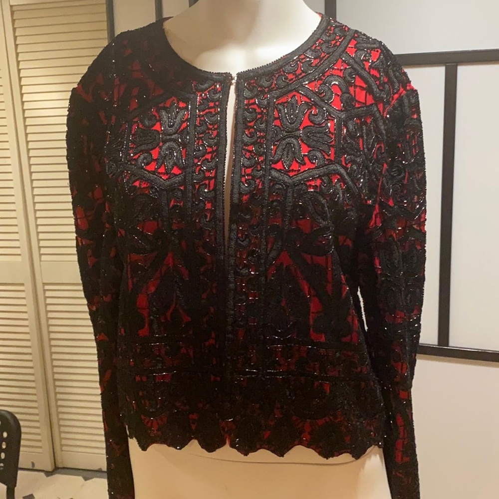 Brand Niteline Delia TouFohali, size medium, black and red